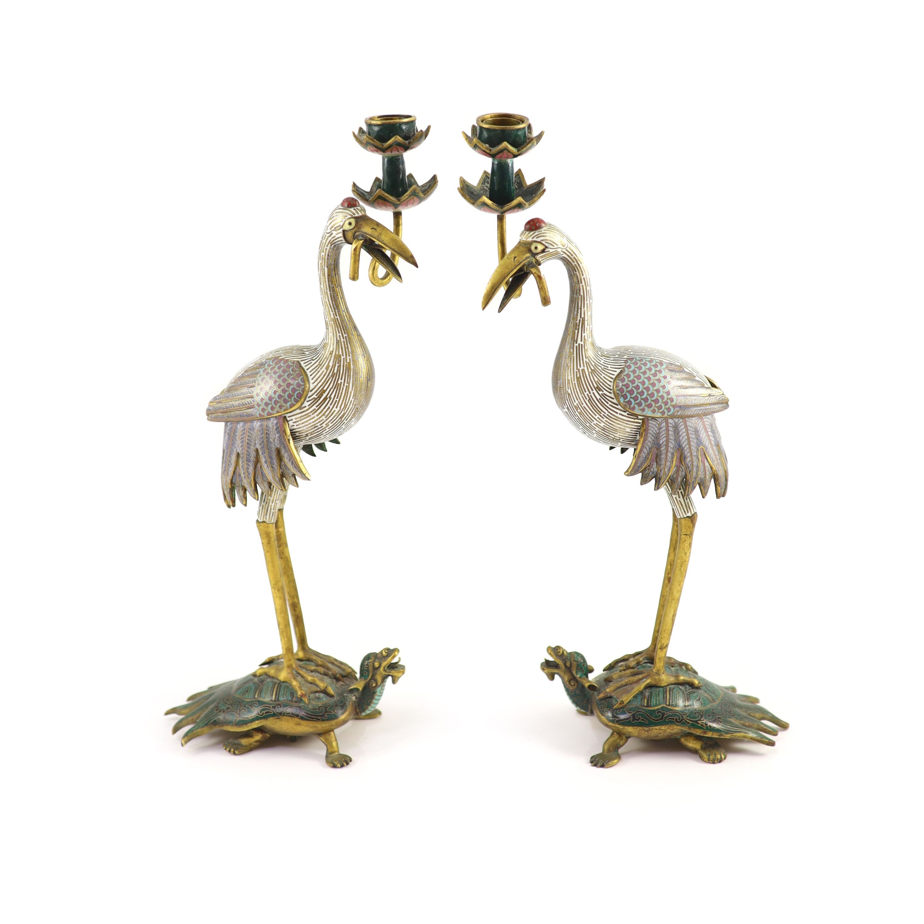 A pair of Chinese cloisonné enamel and gilt bronze ’crane’ candlesticks, early 20th century, 38cm high